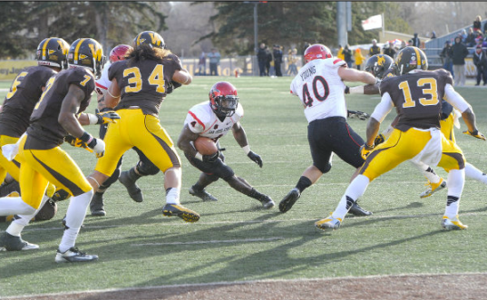 Muema runs with the ball