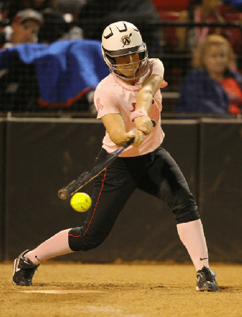 Senior catcher Kristin May swings and connects with the ball vs. Utah State. (Stan Lui)